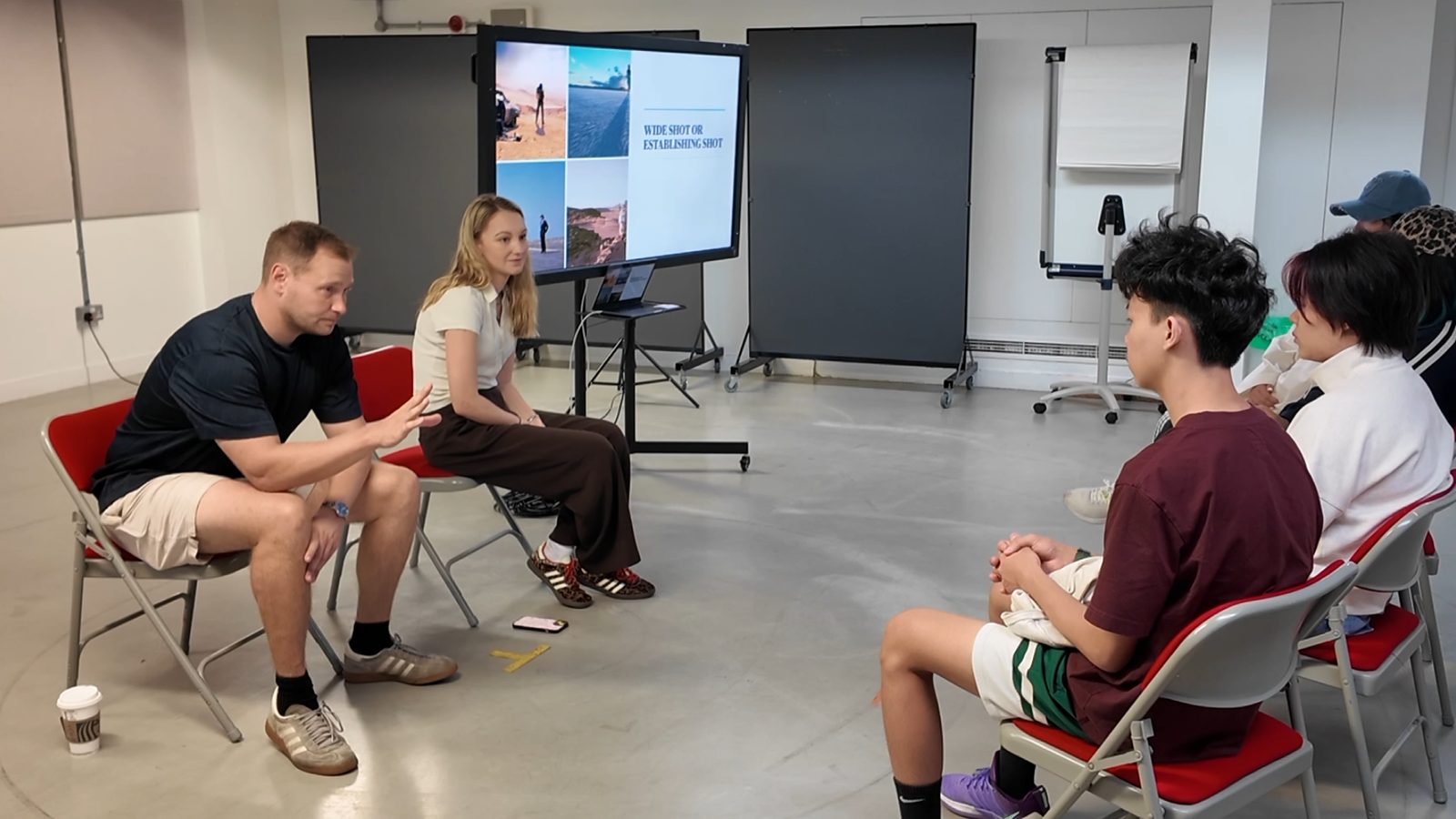 Students receiving feedback from a panel of practitioners