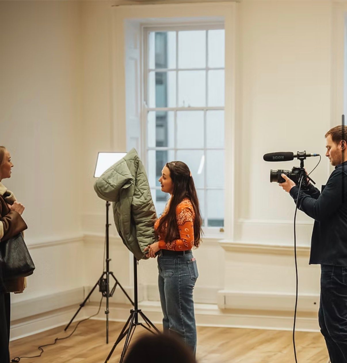 A student performing for a camera operator