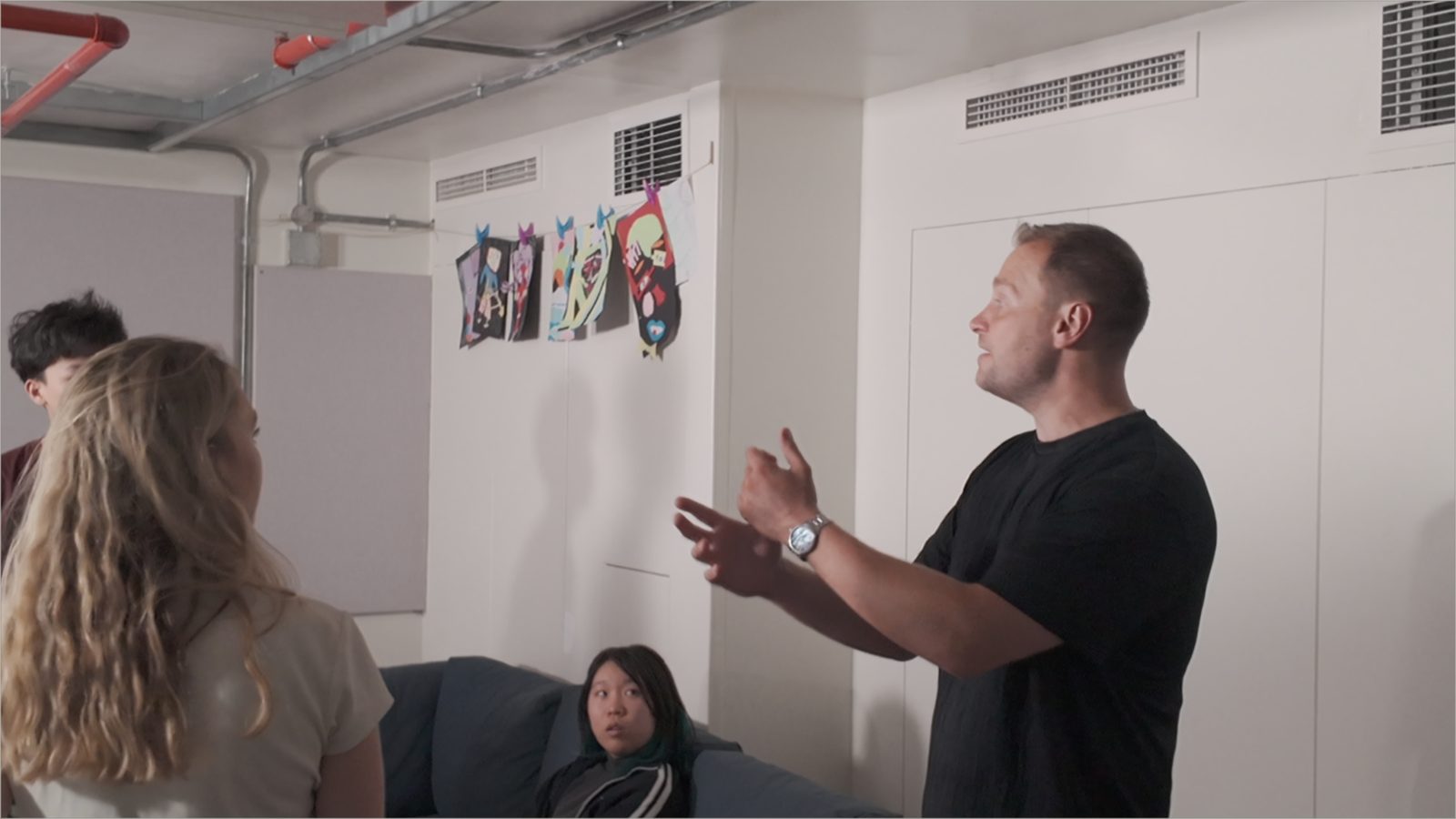 A practitioner leading an acting workshop